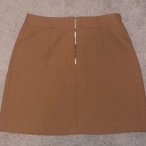 Brown Skirt that comes a few inches above the knee. Barely worn, good condition.